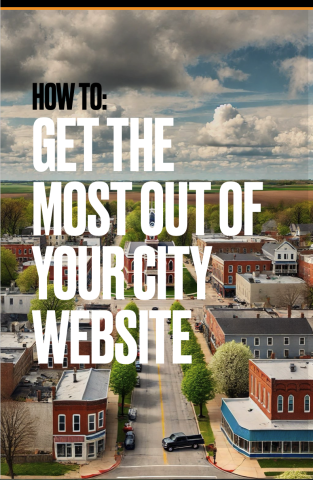 Guide cover - Aerial view of a small town with cloudy skies.